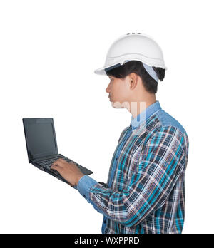 Engineer while holding using Laptop and head wear white safety helmet plastic . Concept Work construction on white background Stock Photo