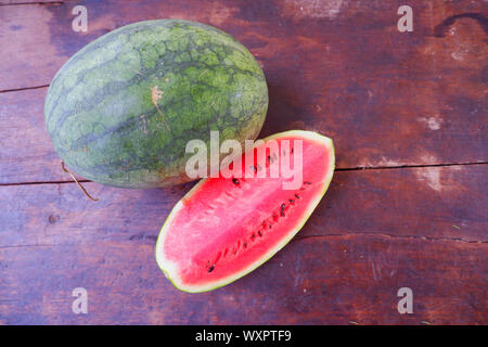 Fresh chopped watermelon on a black wood floor Stock Photo