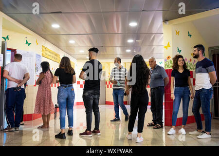 Sakhnin, Israel. 17th Sep, 2019. Israeli Arabs wait in line to cast their vote during the Israeli parliamentary elections. Credit: Oren Ziv/dpa/Alamy Live News Stock Photo