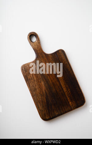 Cutting boards made of wood on white background with copy space Stock Photo