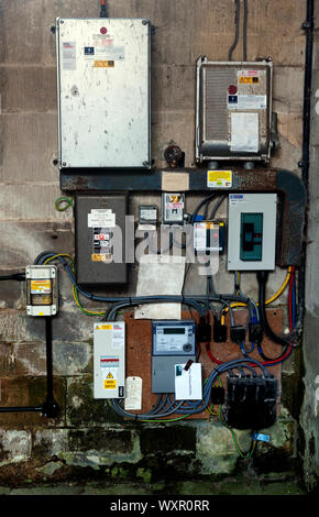 Electrical fuse boxes and wiring inside a church Stock Photo