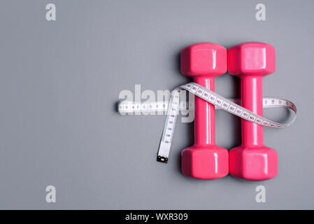 Two pink dumbbells. Sport concept Stock Photo