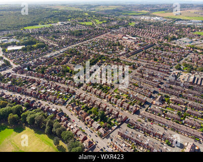 Aerial photo of the town known as Beeston in Leeds West Yorkshire UK, showing a rows of houses in a typical British housing estate taken with a drone Stock Photo