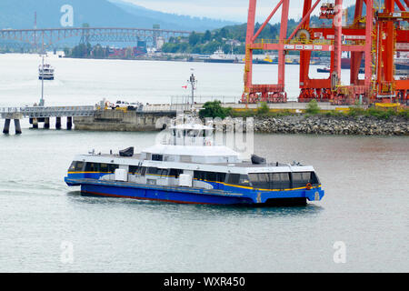 Translink 'Seabus' Approaching Waterfront Ferry Terminal from Londsdale Quay Station, Vancouver, B. C., Canada Stock Photo