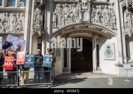 London UK 17th Sep 2019 Demonstrators supporting the case against the prorogation of Parliament hold placards outside the Supreme Court in London. Stock Photo