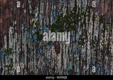Cracking and peeling paint on a wall Stock Photo