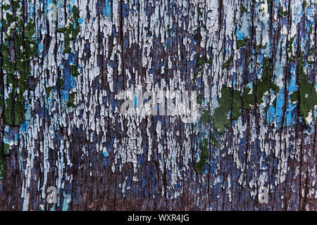 Cracking and peeling paint on a wall Stock Photo
