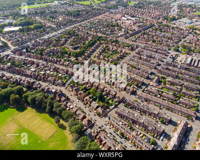 Aerial photo of the town known as Beeston in Leeds West Yorkshire UK, showing a rows of houses in a typical British housing estate taken with a drone Stock Photo