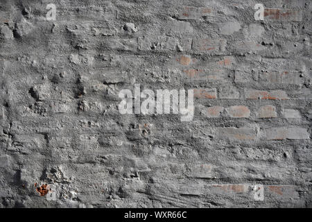 Old vintage cracked bricks with concrete texture. Stock Photo