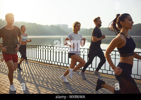 Group of runners in the park in the morning. Stock Photo