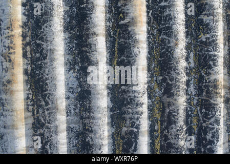 Corrugated iron sheet close up of detail and texture showing lines and patterns. Abstract background rough, weathered Stock Photo