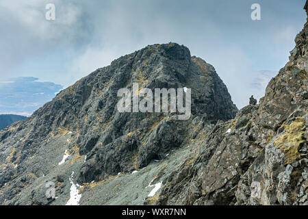 The ridge from Sgurr Alasdair to Sgurr Sgumain in the Cuillin Mountains, Minginish, Isle of Skye, Scotland, UK.  A climber is visible on the traverse. Stock Photo