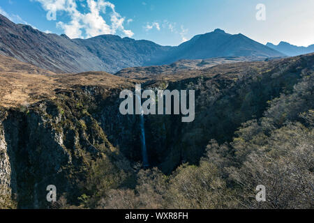 The Eas Mòr waterfall in the Allt Coire na Banachdich gorge with the Cuillin mountains behind.  Glen Brittle, Minginish, Isle of Skye, Scotland, UK Stock Photo