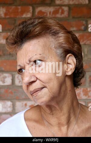 Portrait of an older woman with a serious disappointed stare Stock Photo
