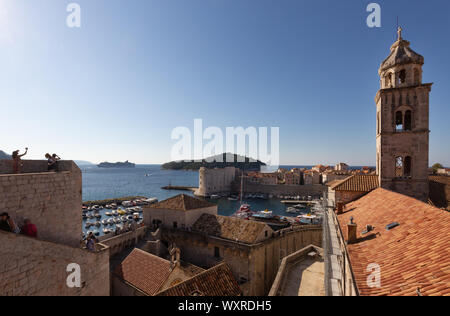 Tourists photographing the belltower of the Dominican Monastery from Dubrovnik city walls; Dubrovnik old town; Dubrovnik Croatia Europe Stock Photo