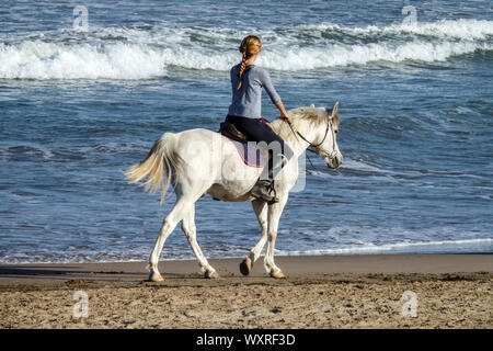 Nude woman riding white horse Stock Photo - Alamy