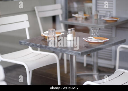 Served tables in a cafe waiting for visitors Stock Photo
