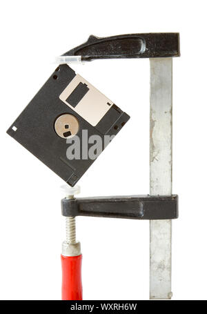Diskette caught in carpentry clamps on a white background Stock Photo