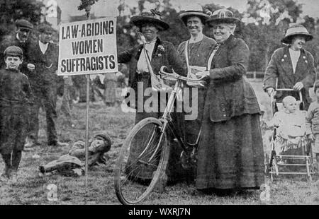 Suffragettes' campaign, c1913. A suffragette was a member of a militant women's organisations in the early 20th century who, under the banner 'Votes for Women', fought for the right for women to vote in public elections, known as women's suffrage. The term refers in particular to members of the British Women's Social and Political Union (WSPU). Stock Photo