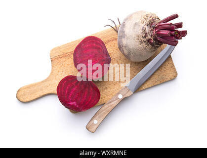 Tasty raw beetroot. Sliced beetroot on cutting board isolated on white background. Stock Photo