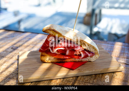 Iberico ham sandwich at Codice Luna restaurant by Far de la Mola lighthouse, Formentera, Balearic Islands, Spain Stock Photo