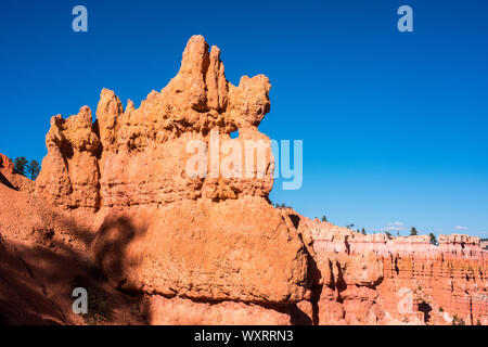 Hoo-doos and rock formations are formed in the sandstone from erosion over the centuries and comprise the colorful view at Bryce Canyon National Park. Stock Photo