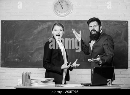 Time to chill. paper work. office life. teacher and student on exam. back to school. Non-formal education. business couple use laptop and document. businessman and secretary. Enjoying time in college. Stock Photo