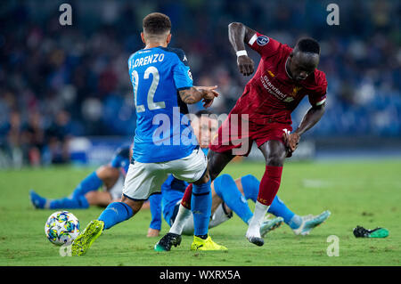 Napoli, Italy. 17th Sep, 2019. Sadio Mane of Liverpool is challenged by Giovanni Di Lorenzo of SSC Napoli during the UEFA Champions League match between Napoli and Liverpool at Stadio San Paolo, Naples, Italy on 17 September 2019. Credit: Giuseppe Maffia/Alamy Live News Stock Photo