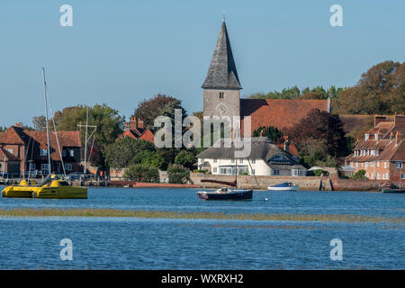 High tide in the picturesque village of Bosham showing the Holy Trinity Church,  Chichester Harbour, West Sussex, England, UK Stock Photo