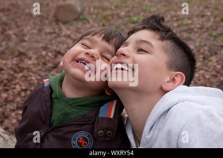Two young brothers laughing Stock Photo