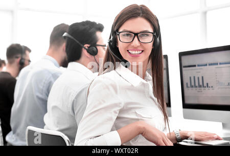 employee of the business center using the computers to analyze the data Stock Photo