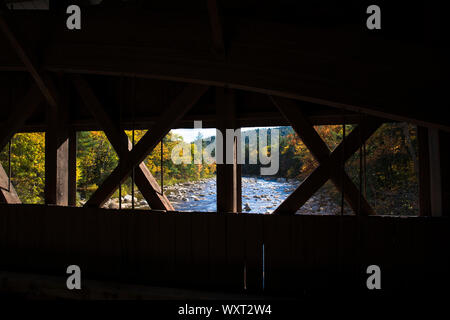 Wooden beams of covered bridge along the Kancamagus Highway in The White Mountains in New Hampshire, USA Stock Photo