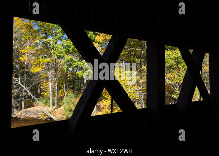 Wooden beams of covered bridge along the Kancamagus Highway in The White Mountains in New Hampshire, USA Stock Photo