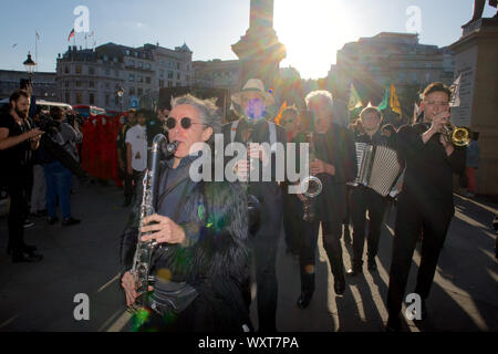 London, UK. 17th Sep 2019. Extinction Rebellion activists call on all citizens, including the industry itself, to demand an end to London Fashion Week and to put the toxic system of consumption to rest forevermore. The 'funeral procession' marched form Trafalgar Square to London Fashion Week show on the Strand where thy gave speaches and conducted a ‘die-in’, calling for the fashion industry to tell the truth about its contribution to the climate and ecological crisis Credit: Gareth Morris/Alamy Live News Stock Photo