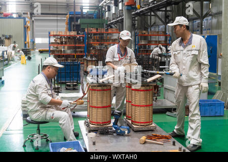 Changsha. 17th Sep, 2019. Photo taken on Sept. 17, 2019 shows staff working at the workshop of the CRRC Zhuzhou Electric Co., Ltd. in Zhuzhou City, central China's Hunan Province. CRRC Zhuzhou Electric Co., Ltd. unveiled the key components of its magnetic-levitation train with a designed speed of 600 kph in central China's Hunan Province Tuesday. Credit: Chen Sihan/Xinhua Stock Photo