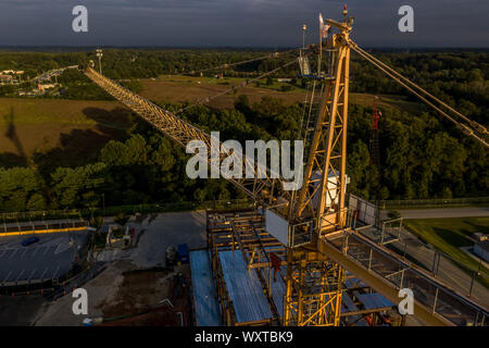 aerial view of construction site with cranes and high-rise apartment ...