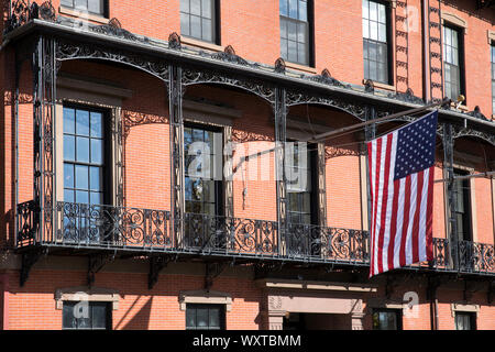 Patriotic Stars and Stripes flag on flagpole at the Union Club in Park Street, Boston, Massachusetts, USA