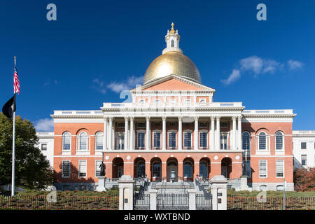 Massachusetts State House the seat of Government, with golden dome and patriotic Stars and Strips flag in the city of Boston, USA Stock Photo