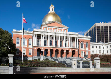 Massachusetts State House the seat of Government, with golden dome and patriotic Stars and Strips flag in the city of Boston, USA Stock Photo