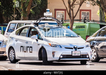 Sep 17, 2019 Mountain View / CA / USA - Nuro autonomous vehicle driving on a street in Silicon Valley; Nuro is a robotics company founded by two ex Wa Stock Photo