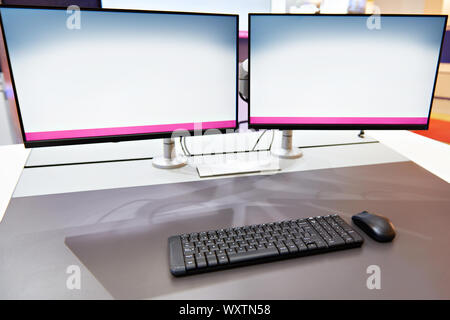 Ergonomic workplace with keyboard and monitors concept Stock Photo