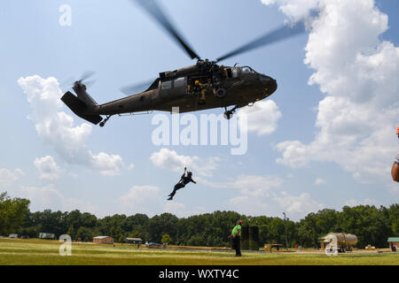 The Helicopter Aquatic Rescue (HART) Academy hosts its first joint training event at the South Carolina Fire Academy in Columbia, South Carolina, Aug. 12-16, 2019.  South Carolina National Guard Soldiers and first responders will provide other states on best practices and procedures for HART team implementation throughout the country, Indiana being the first class to train at the academy.  The academy is a joint training initiative by South Carolina, North Carolina, Pennsylvania and Texas to create full-scale training events between the National Guard and civilian agencies, implementing comple Stock Photo