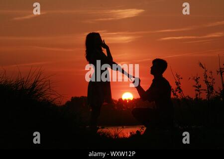 Married couple together landscape, love, lover, close-up, dark, night, sunset, freedom, outside Stock Photo