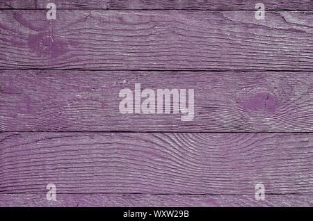 Wooden background texture. Creatively painted intense violet boards. Stock Photo