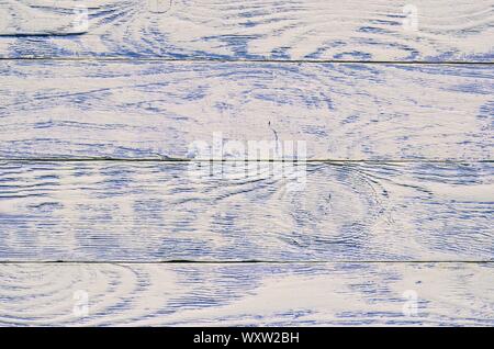 Wooden background texture. Creatively painted white and purple boards. Stock Photo
