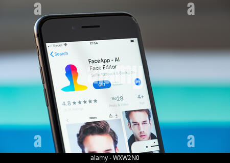 Kyiv, Ukraine - September 17, 2019: Studio shot of Apple iPhone 8 smartphone with FaceApp mobile application on the screen Stock Photo