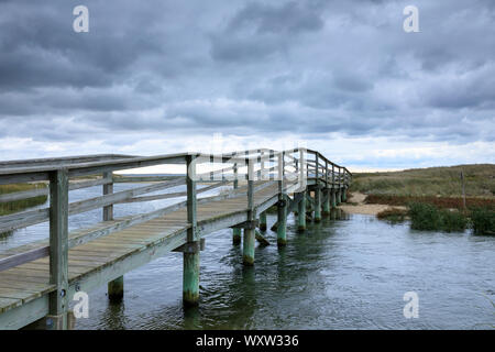 Wooden footbridge walkway at Ridgevale Beach, Nantucket Sound, Cape Cod, New England, USA Stock Photo