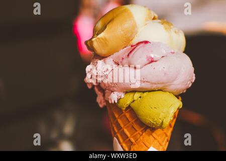 Delicious gelato, organic dairy and homemade recipe concept - Ice cream cone melting outdoors in summer, sweet dessert food on holiday Stock Photo