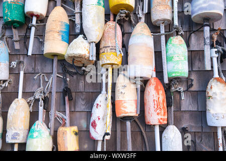 Colourful lobster buoys on oak shingle at Captain Cass - Cap't Cass Rock Harbor Seafood Cafe at Orleans, Cape Cod, New England, USA Stock Photo