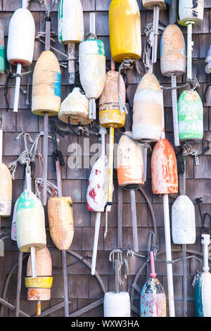 Colourful lobster buoys on oak shingle at Captain Cass - Cap't Cass Rock Harbor Seafood Cafe at Orleans, Cape Cod, New England, USA Stock Photo